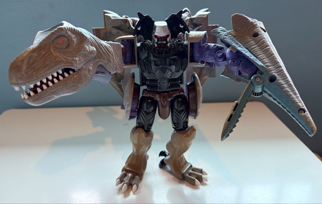 Transformers (T-Rex line) Grimlock and Megatron Figures (Category: Action & Battle Toys) located in Santa Rosa. Submitted by serf60762 (Listing ID 1464491853, Image 2). Description: Selling the following Transformers T-Rex action figures: 1. Transformers: Beast Wars Ultra Class Megatron (1995) by Hasbro for PhP 2K 2. Transformers Classics Deluxe Class Grimlock (2006) by Hasbro for PhP 2K 3. Transformers Animated Voyager Class Grimlock (2008) by H