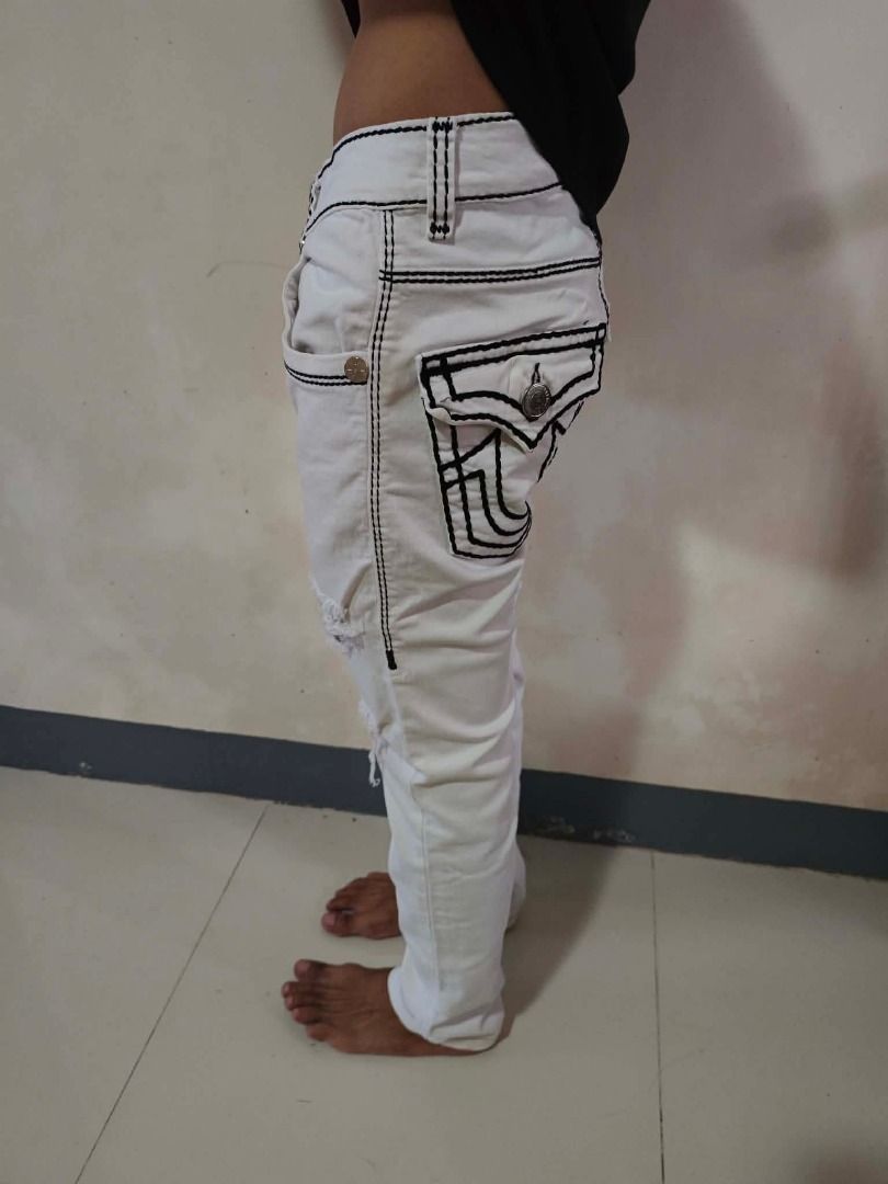 True Religion White Jeans with Black Stitching Size 30 (Category: Jeans) located in Caloocan City. Submitted by silverbird_6c038f (Listing ID 1464455547, Image 1). Description: - White True Religion Jeans - Size: 30 - Black contrast stitching - Distressed details on legs - Straight seat fit - Made in USA - Ideal for a casual look.