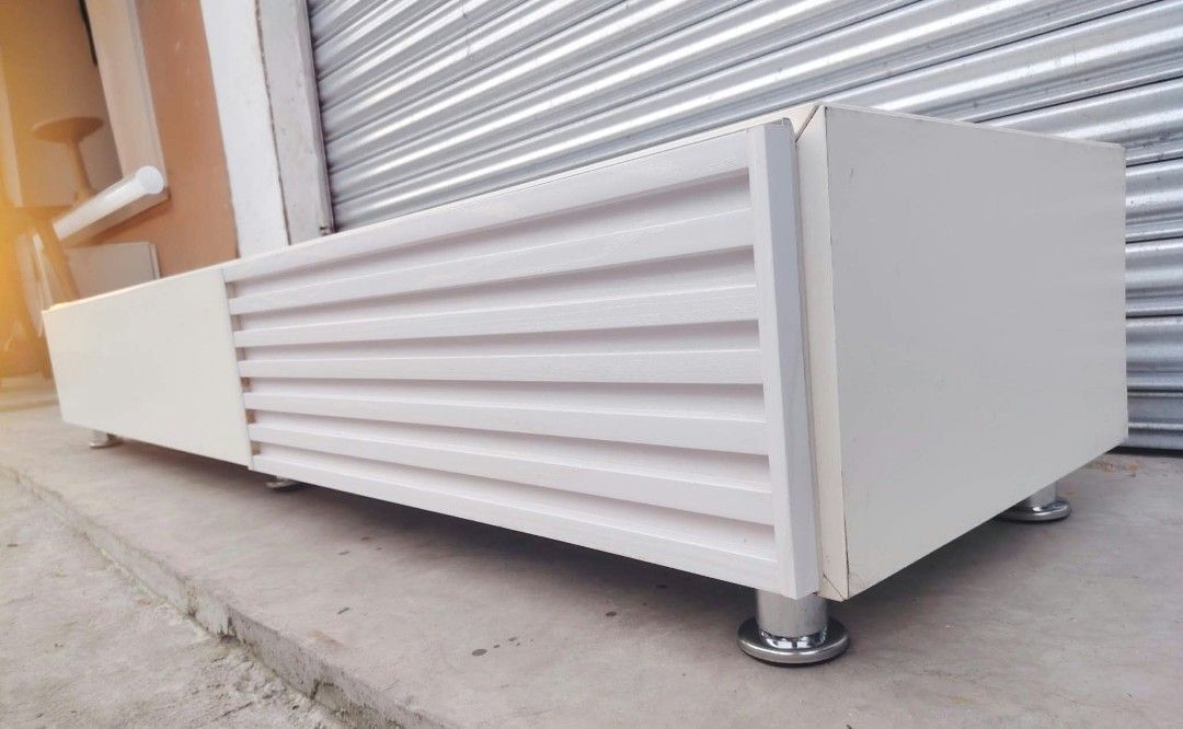 TV Rack low type (Category: TV Consoles) located in Taguig. Submitted by sydney08.owl (Listing ID 1464531268, Image 3). Description: item: LONG TV RACK (Low type) Size: L-76 W-19 H-11 inches Price: ₱9500+ delivery fee Description: -Made of wood and plyboard -2 cabinet door equipped w/ PNEUMATIC lift support mechanism for easy opening -Minimal scratches.