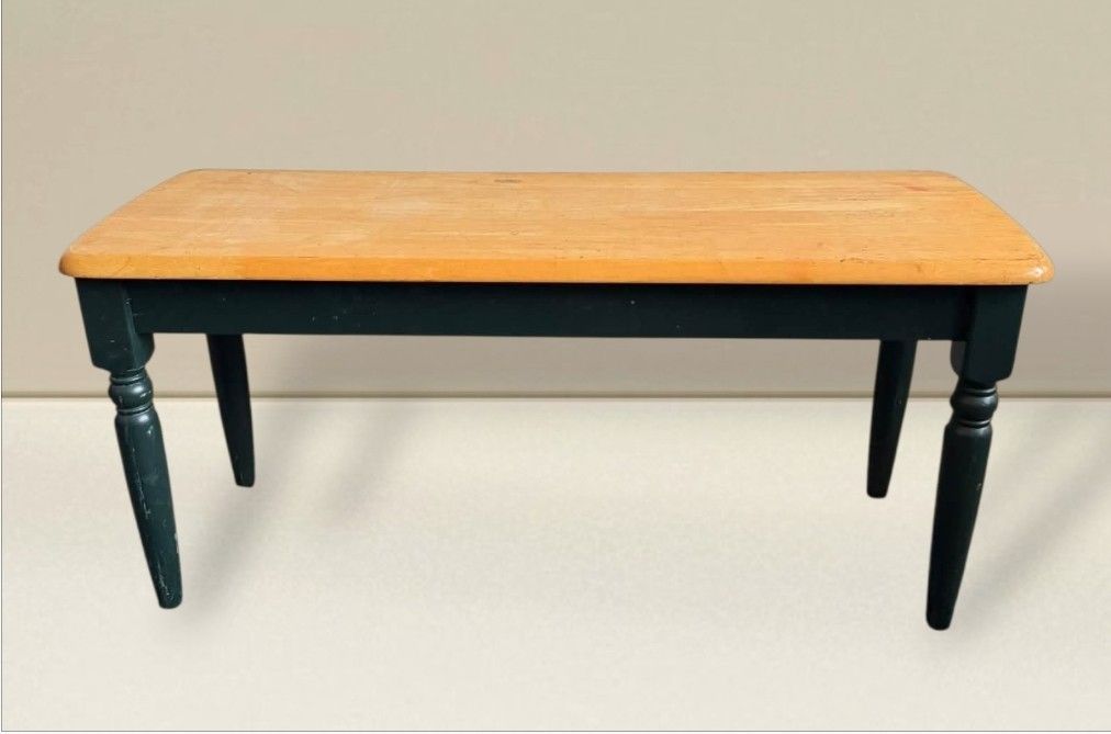 Two Tone Wooden Bench (Category: Chairs) located in Quezon City. Submitted by dannikkishoppe2 (Listing ID 1464385734, Image 1). Description: Two Tone Wooden Bench ‼️₱4500‼️ • light wood top and dark green legs. • Rounded corners on the wood top. • Legs feature a classic turned detail. • Ideal for entryways or as a footrest. • Dimensions: Approximately 40 inches long, 15 inches wide, and 18 inches high. • Note: Minor marks present on the wood top.