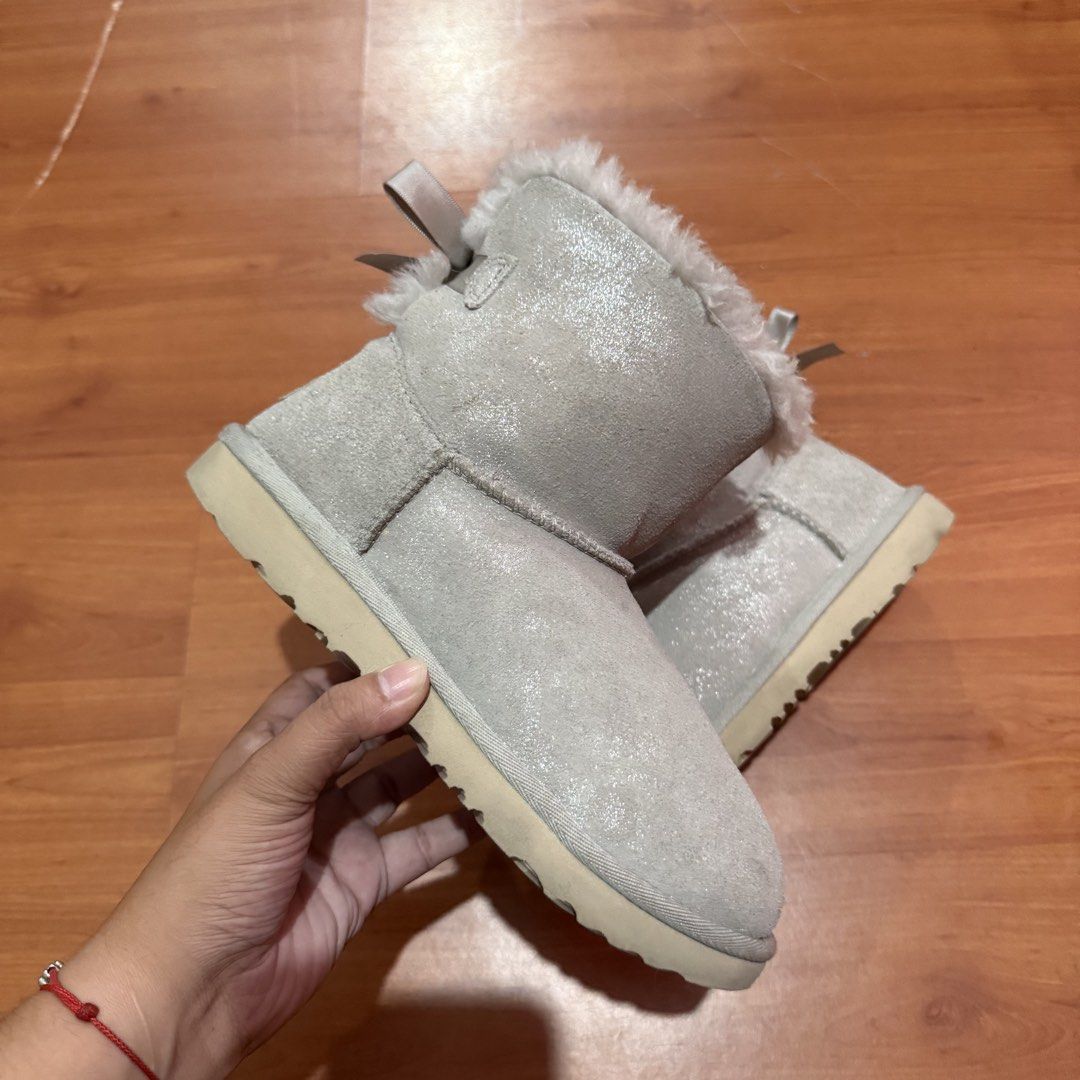 UGG Mini Bailey Bow Sparkle Boots (Category: Boots) located in Baguio. Submitted by puss_n_boots2600 (Listing ID 1464415038, Image 2). Description: UGG Mini Bailey Bow Sparkle Boots Size 35 No Flaws.