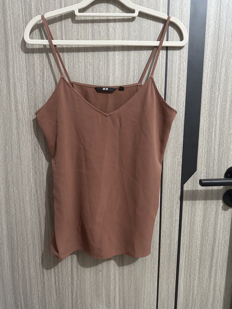 Uniqlo Brown Cami Top Size S (Category: Sleeveless) located in Manila. Submitted by micsevang59553 (Listing ID 1464468070, Image 1). Description: - Uniqlo brown cami top - Features spaghetti straps - V-neckline design - Versatile for layering or wearing on its own - Easy to pair with various outfits.