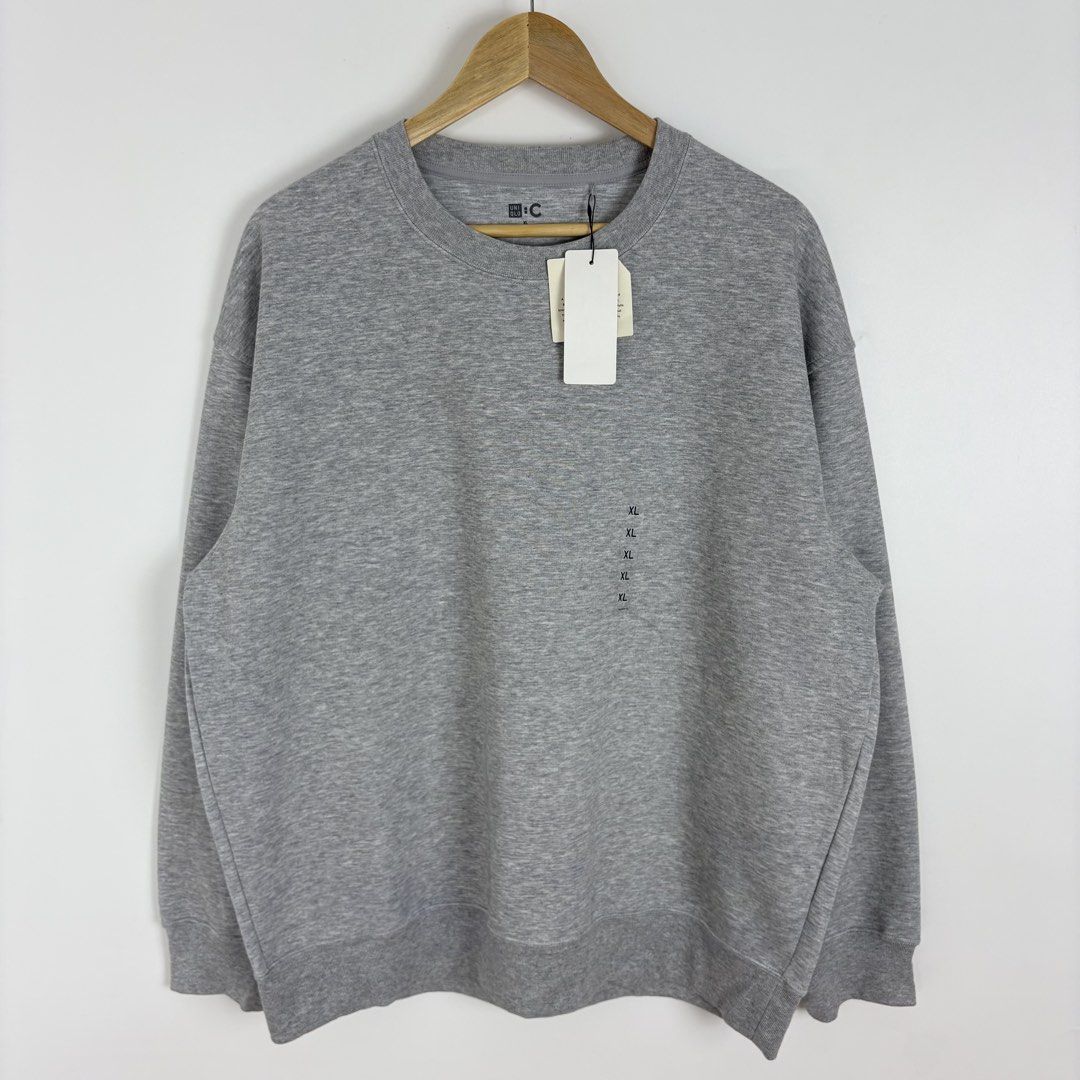 Uniqlo :C Oversized Grey Sweatshirt (Category: Coats, Jackets and Outerwear) located in Calamba. Submitted by 2muchclothes_ (Listing ID 1464423172, Image 1). Description: Measurements Size: XL Width: 26 Length: 28.5 Shoulder: 23.5 Sleeve: 23.