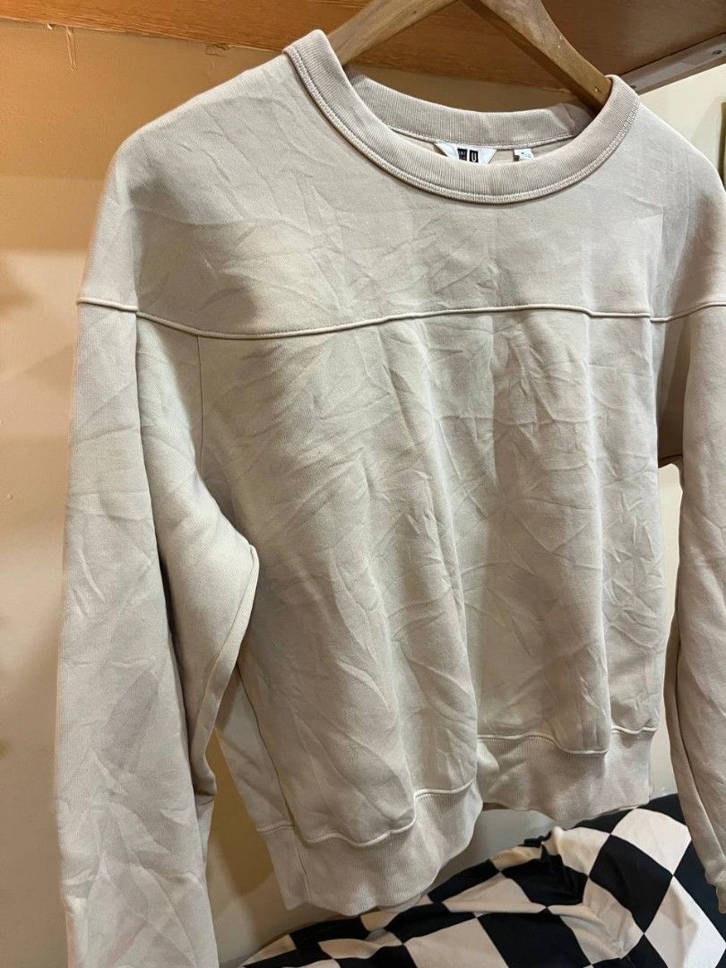 Uniqlo cream cropped sweater (Category: Coats, Jackets and Outerwear) located in Quezon City. Submitted by michypeachyy1 (Listing ID 1464497847, Image 2). Description: 200 plus shipment width 22.5 inches length 20.5 inches sleeves 20 inches.