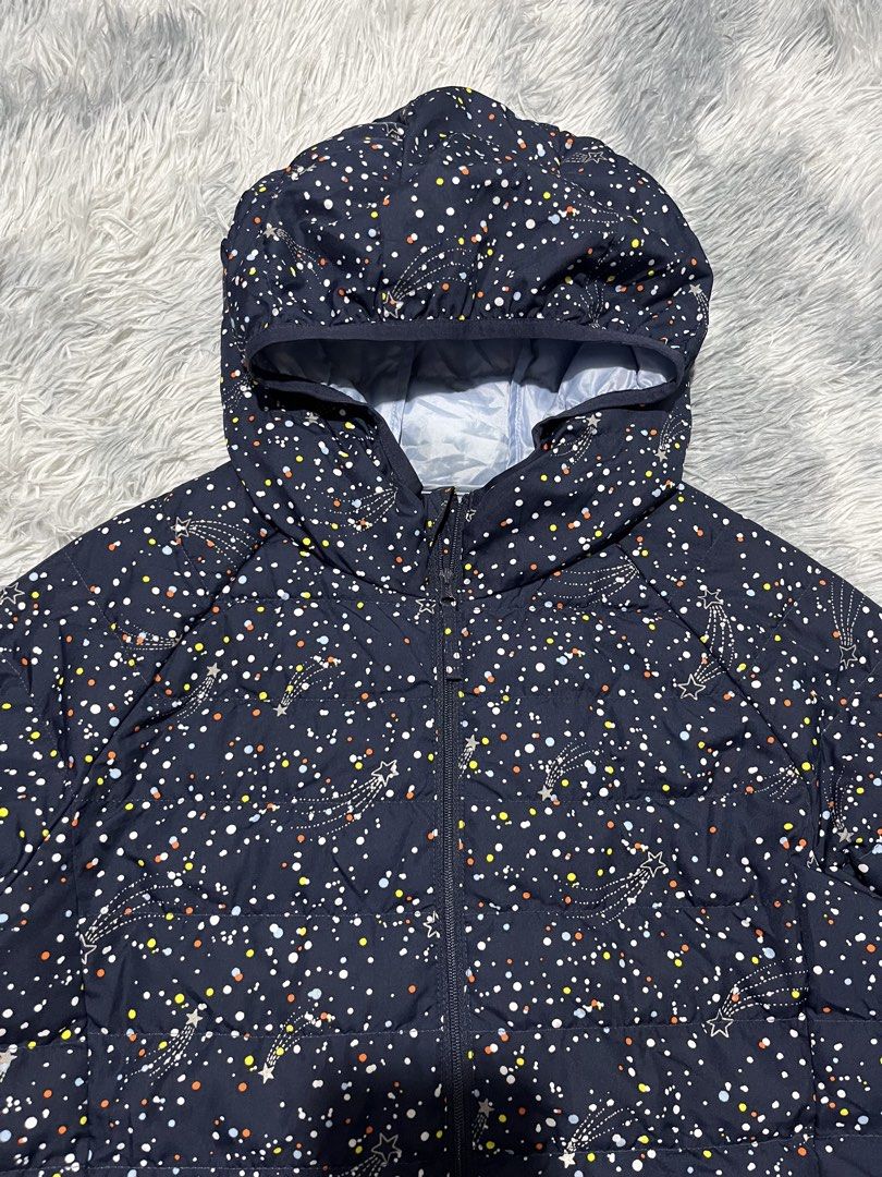 Uniqlo Space Pattern Puffer Jacket (Category: Babies & Kids Fashion) located in Sasmuan (Sexmoan). Submitted by winterclothes.ph (Listing ID 1464414236, Image 2). Description: Uniqlo Space Pattern Puffer Jacket 150 on tag Kids Width 18 Length 22.5 Excellent Condition.