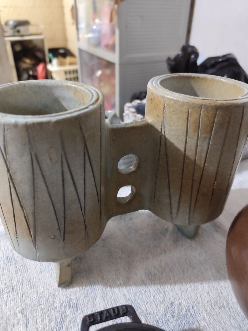 Unique Double Ceramic Pot Planter (Category: Pots & Planters) located in Manila. Submitted by marriage031073advocate (Listing ID 1464419054, Image 1). Description: - Unique double ceramic pot with vertical line design. - Ideal for small plants or succulents. - Doubles as a desk organizer for pens or brushes. - Dimensions: Approx. X inches tall, Y inches wide. - A unique decorative piece for your home..