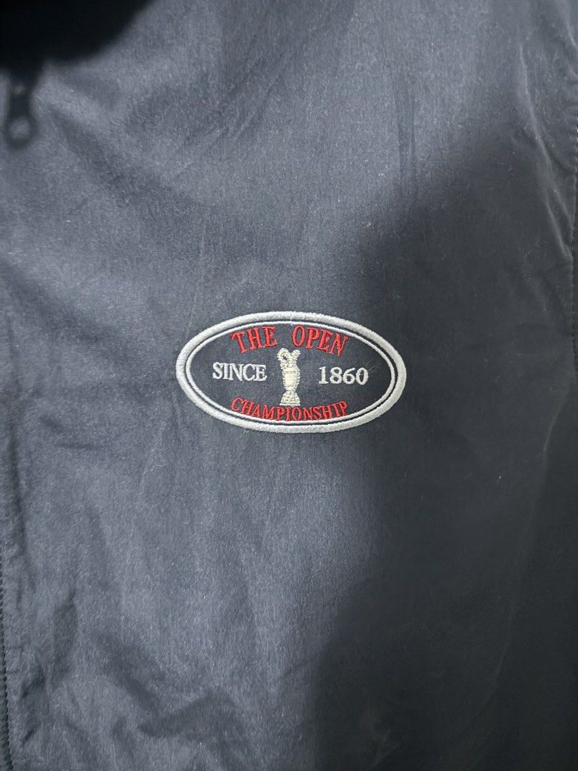 Vest Navy Blue - The Open Championship (Category: Vests) located in Manila. Submitted by psalmcedri90524 (Listing ID 1464409571, Image 2). Description: 26 width, Reversible - Navy blue vest from The Open Championship - Official logo embroidered on chest - Zippered pockets with branded pulls - Soft grey fleece lining inside - Perfect for layering in cooler weather - Great for golf enthusiasts.