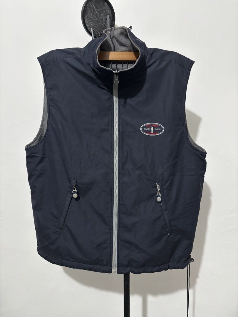 Vest Navy Blue - The Open Championship (Category: Vests) located in Manila. Submitted by psalmcedri90524 (Listing ID 1464409571, Image 1). Description: 26 width, Reversible - Navy blue vest from The Open Championship - Official logo embroidered on chest - Zippered pockets with branded pulls - Soft grey fleece lining inside - Perfect for layering in cooler weather - Great for golf enthusiasts.