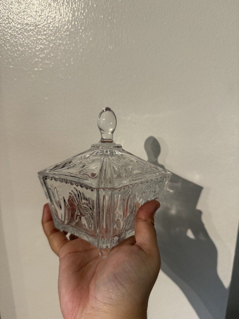 Vintage Clear Glass Candy Dish with Lid (Category: Food Organization & Storage) located in Quezon City. Submitted by pamelasal51714 (Listing ID 1464502983, Image 1). Description: - Square glass dish with a lid - Features an etched decorative pattern - Ideal for storing candies, trinkets, or small items - Lid has a convenient knob for easy opening - Enhances the look of any table or shelf.