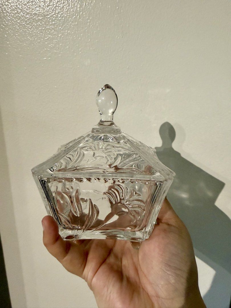 Vintage Clear Glass Candy Dish with Lid (Category: Food Organization & Storage) located in Quezon City. Submitted by pamelasal51714 (Listing ID 1464502983, Image 2). Description: - Square glass dish with a lid - Features an etched decorative pattern - Ideal for storing candies, trinkets, or small items - Lid has a convenient knob for easy opening - Enhances the look of any table or shelf.