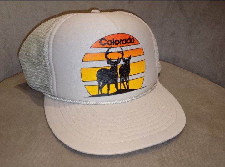 Vintage Colorado Sunset Deer Trucker Hat (Category: Caps & Hats) located in Binangonan. Submitted by yuristalin888 (Listing ID 1464565850, Image 3). Description: Embrace the vintage aesthetic with this classic **Nissin Cap** trucker hat. Featuring a nostalgic front graphic of two deer silhouetted against a warm Colorado sunset, this hat blends retro charm with outdoor style. * **Design:** Bold front print showcasing "Colorado" in retro typography