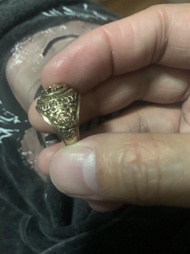 Vintage Gold Tone Ring with Intricate Design (Category: Rings) located in Quezon City. Submitted by pat3ciaforbes (Listing ID 1464455968, Image 3). Description: Vintage UST college 10k gold 9.5g ring with ornate detailing. A classic, textured band and a central emblem make this a unique accessory or collection. .