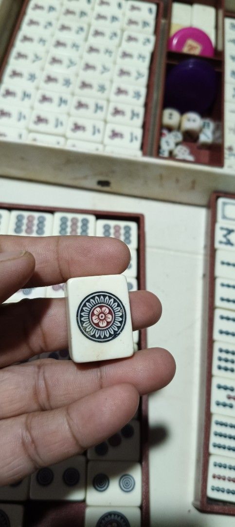 Vintage Mahjong Set with Case and Accessories (Category: Board Games & Puzzles) located in Manila. Submitted by superbass1982 (Listing ID 1464524580, Image 1). Description: - Complete vintage Mahjong set - Includes all tiles, dice, and accessories - Tiles made of durable material - Case features a 'KKK' emblem - Case shows some signs of wear but is fully functional - Great for game nights and Mahjong enthusiasts.