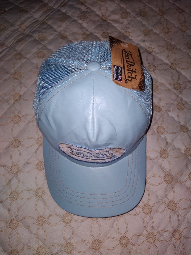 Vintage Von Dutch Trucker Cap (Category: Activewear) located in Zamboanga. Submitted by zhumhazhav (Listing ID 1464529561, Image 1). Description: This is a Vintage Von Dutch Trucker cap in pastel blue color way. Features te brand classic embroidered oval logo patch on the front. One size fits most Excellent condition with hang tag Pastel blue color way No issue need wash only Check all photos for details 650+shipping fee.