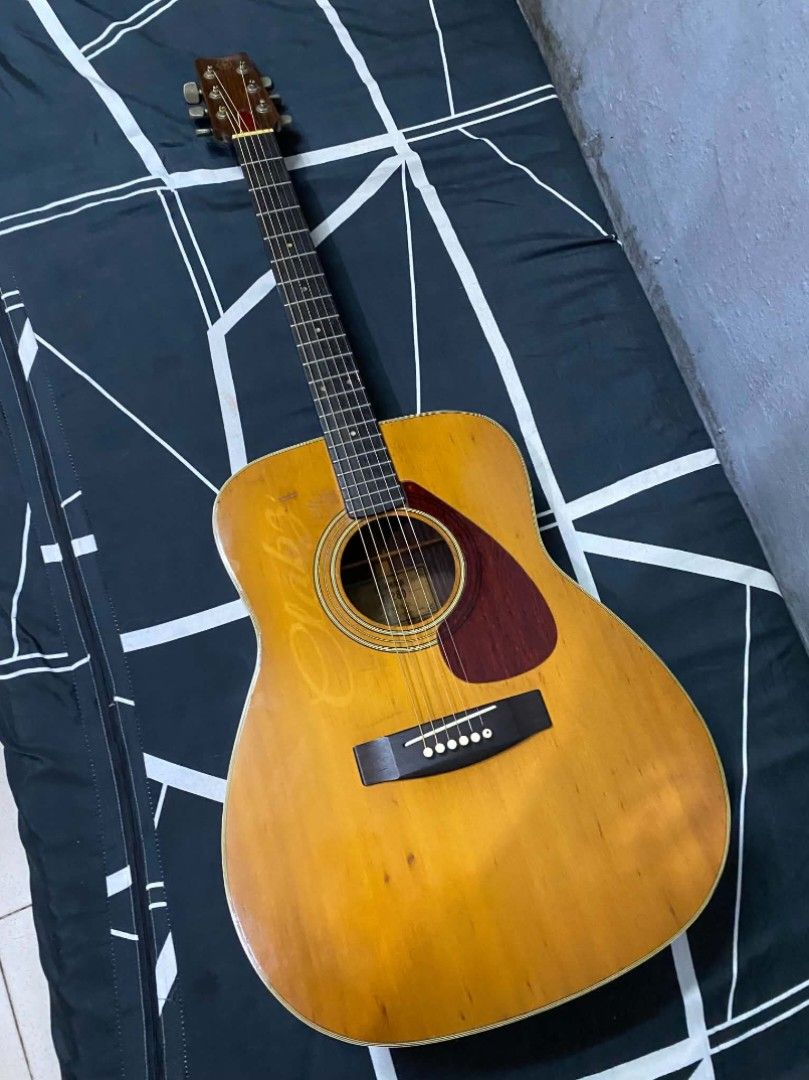 Vintage Yamaha fg-280 green label (Category: Musical Instruments) located in Quezon City. Submitted by jaycrisminosa2 (Listing ID 1464471921, Image 1). Description: - Yamaha acoustic guitar - Natural wood finish - Dark pickguard - Signs of wear consistent with use (body) - Tuners and bridge appear intact - Ready for a new owner.