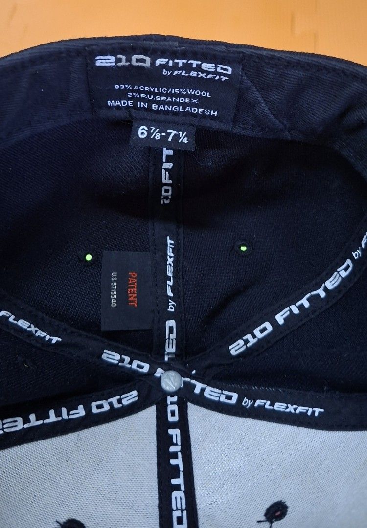 Volcom Fitted Cap by Flexfit (Category: Caps & Hats) located in Manila. Submitted by declutrredgoods (Listing ID 1464390133, Image 3). Description: - Classic black Volcom cap - Features iconic Volcom logo on the front - Comfortable Flexfit technology for a perfect fit - Material: 83% acrylic, 15% wool, 2% spandex for stretch - Size: 6 7/8 - 7 1/4 - Made in Bangladesh.