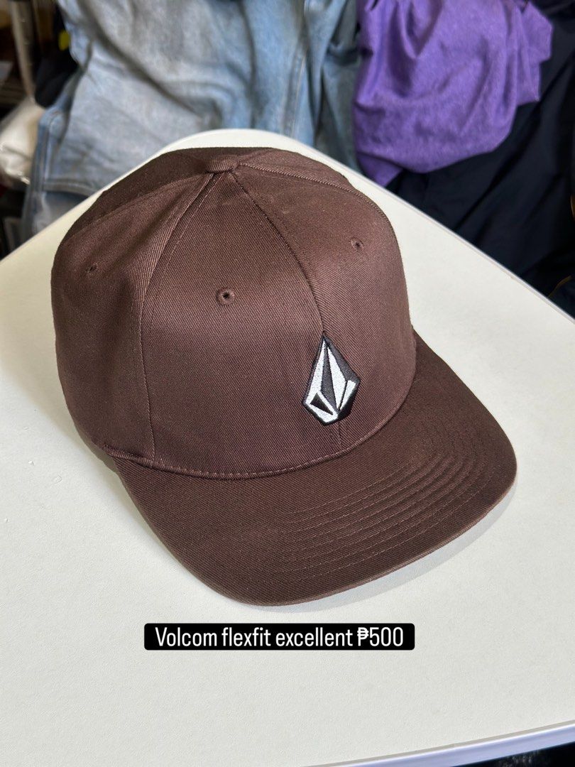 Volcom Flexfit Cap Brown S-M (Category: Caps & Hats) located in Daet. Submitted by thrifthings2018 (Listing ID 1464408882, Image 1). Description: - Brand: Volcom - Style: Flexfit Cap - Color: Brown - Size: S-M - Features: Volcom logo on front, Volcom text on back - Condition: Good, ready for a new owner.
