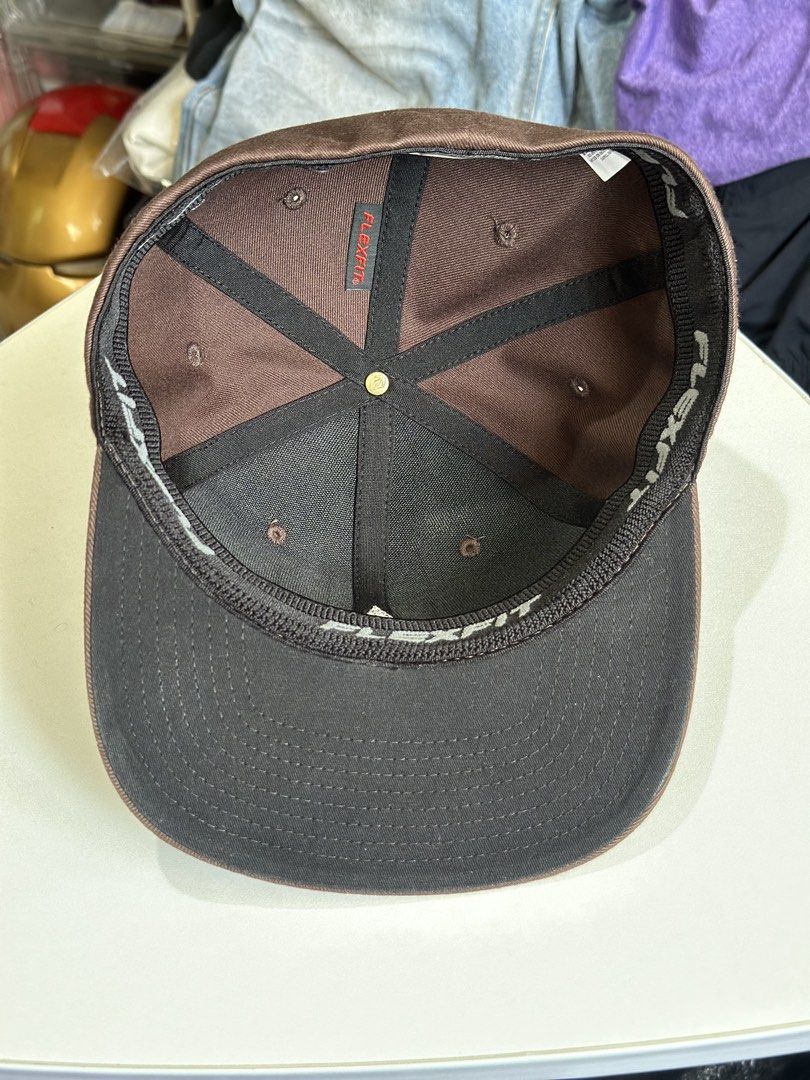 Volcom Flexfit Cap Brown S-M (Category: Caps & Hats) located in Daet. Submitted by thrifthings2018 (Listing ID 1464408882, Image 2). Description: - Brand: Volcom - Style: Flexfit Cap - Color: Brown - Size: S-M - Features: Volcom logo on front, Volcom text on back - Condition: Good, ready for a new owner.