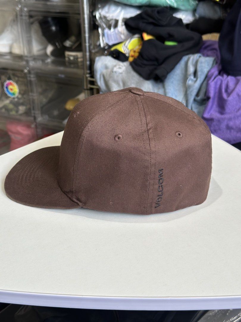 Volcom Flexfit Cap Brown S-M (Category: Caps & Hats) located in Daet. Submitted by thrifthings2018 (Listing ID 1464408882, Image 3). Description: - Brand: Volcom - Style: Flexfit Cap - Color: Brown - Size: S-M - Features: Volcom logo on front, Volcom text on back - Condition: Good, ready for a new owner.