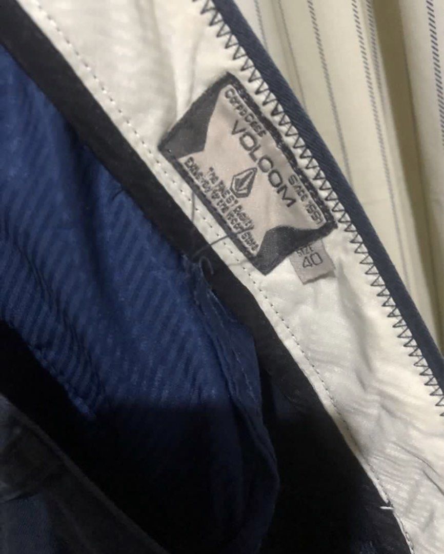 Volcom Navy Blue Chino Shorts Size 40-42 (Category: Shorts) located in Calapan. Submitted by shakalak (Listing ID 1464443566, Image 3). Description: - Brand: Volcom - Color: Navy Blue color rate 8/10 -See last 2 photo for issue - Size: 40 ( 21x23) - Style: Classic Chino Shorts - Features: Front and back pockets - Comfort: Comfortable for everyday wear - Occasion: Good for casual outings.