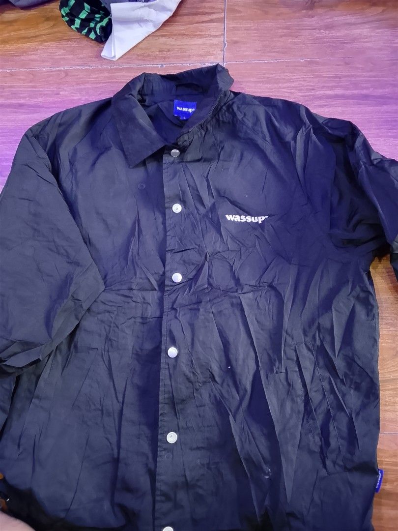 Wassup Black Coach Jacket (Category: Coats, Jackets and Outerwear) located in Las Pinas. Submitted by solisjethr46316 (Listing ID 1464535944, Image 1). Description: - Black Wassup coach jacket - Button-up front with collar - Wassup logo printed on front and back - Lightweight material - Ideal for layering.
