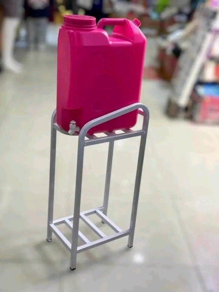 Water Dispenser Stand with Water Jug (Category: Water Purifiers & Dispensers) located in Quezon City. Submitted by marecel146 (Listing ID 1464380865, Image 1). Description: - Sturdy metal stand for water jugs - Includes a convenient tap - Available in pink or blue - Ideal for home or office - Keeps water jug elevated for easy dispensing.