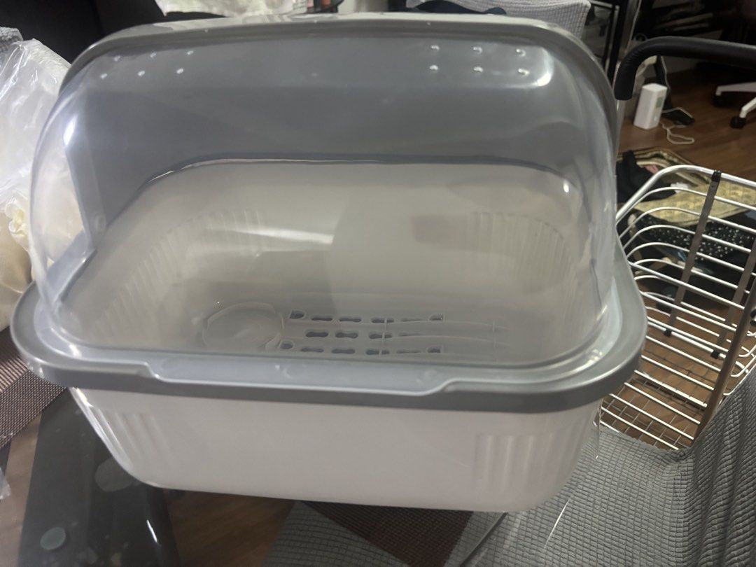 White and Grey Dish Rack with Lid (Category: Food Organization & Storage) located in Quezon City. Submitted by uniquebotique (Listing ID 1464505935, Image 1). Description: - White and grey dish rack - Clear lid to keep dishes covered and clean - Base with drainage holes for efficient drying - Compact size, ideal for smaller kitchens - Easy to clean - Feel free to ask any questions!.