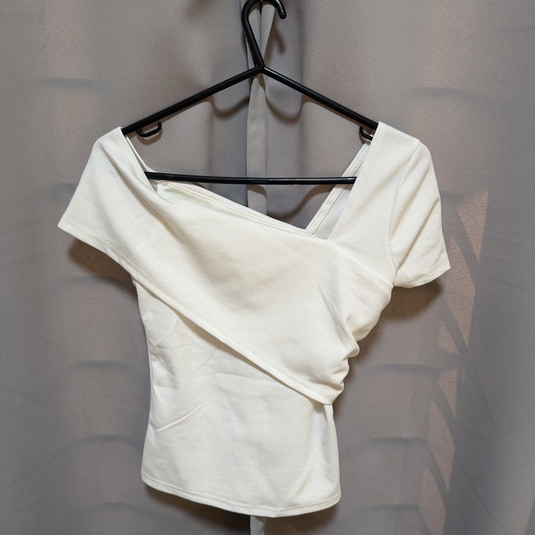 White Asymmetrical Wrap Short Sleeve Top (Category: Blouses) located in Makati City. Submitted by heyitsg_ (Listing ID 1464415241, Image 1). Description: - Short sleeved with a ribbed texture - No when worns.