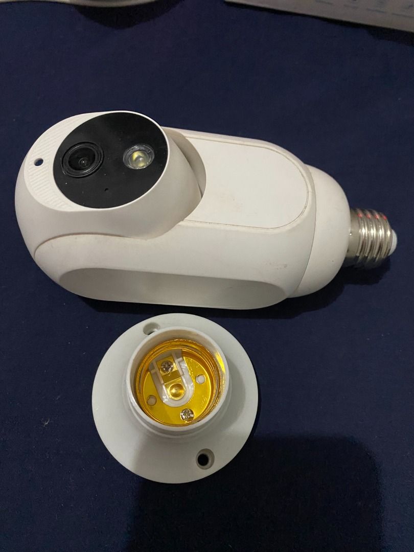 White Bulb Security Camera with Mount (Category: Security Systems & CCTV Cameras) located in Taguig. Submitted by azil16 (Listing ID 1464515292, Image 2). Description: - White security camera designed to screw into a standard light bulb socket. - Features a rotating head for 360-degree panoramic viewing. - Includes mounting base for easy setup. - Ideal for home security and monitoring. - Simple installation process, no complex wiring needed..