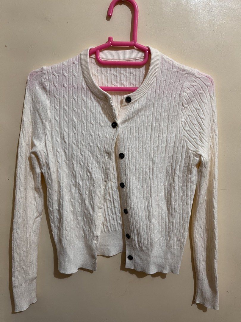 White Cable Knit Button Up Cardigan (Category: Coats, Jackets and Outerwear) located in Legazpi City. Submitted by sandras. (Listing ID 1464519762, Image 1). Description: - Cozy white cable knit cardigan - Long sleeves - Button-up front closure - Classic crew neck style - Ideal for layering during cooler weather - Estimated size: Small to Medium.