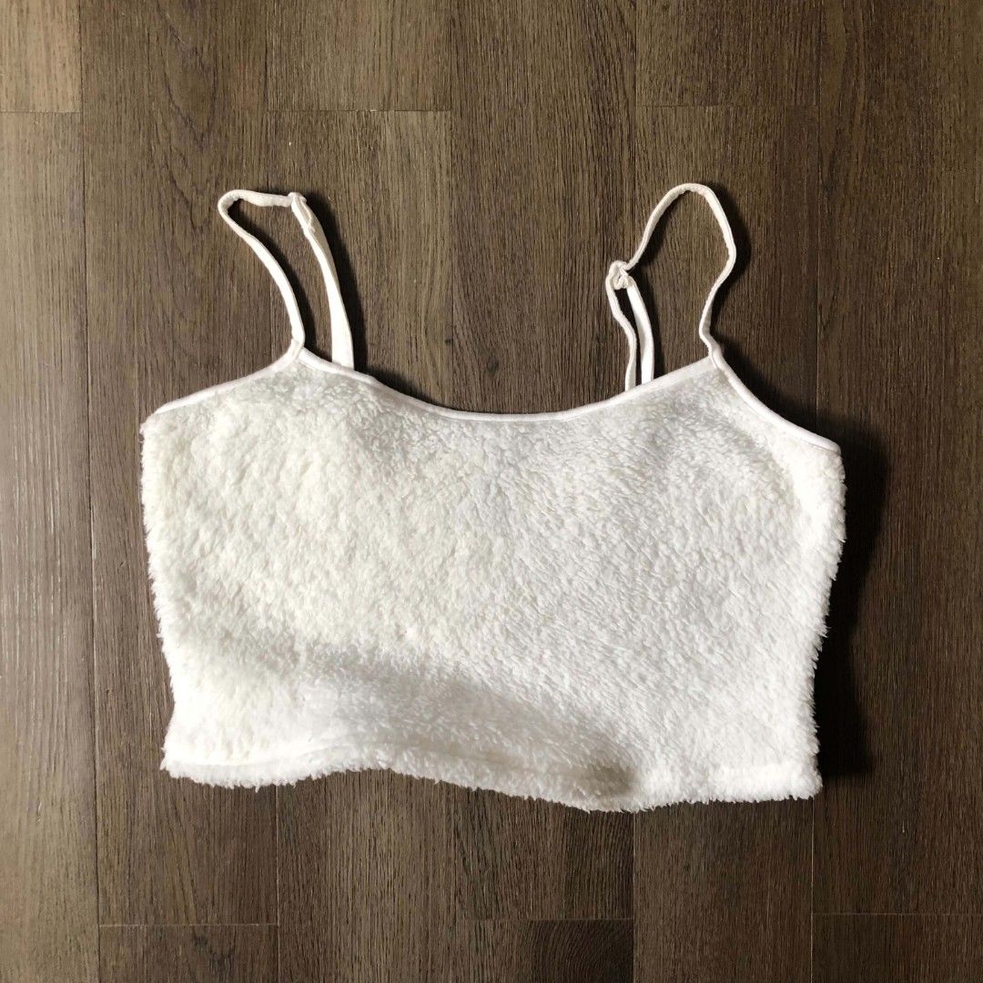 White Fuzzy Crop Top with Spaghetti Straps (Category: Sleeveless) located in Manila. Submitted by joshbelgic17602 (Listing ID 1464438977, Image 1). Description: - Super soft and cozy white fuzzy crop top - Features thin spaghetti straps - Raw, frayed edge hem - Versatile for layering or wearing alone - Ideal for lounging or a casual night out - Made with very comfortable material.
