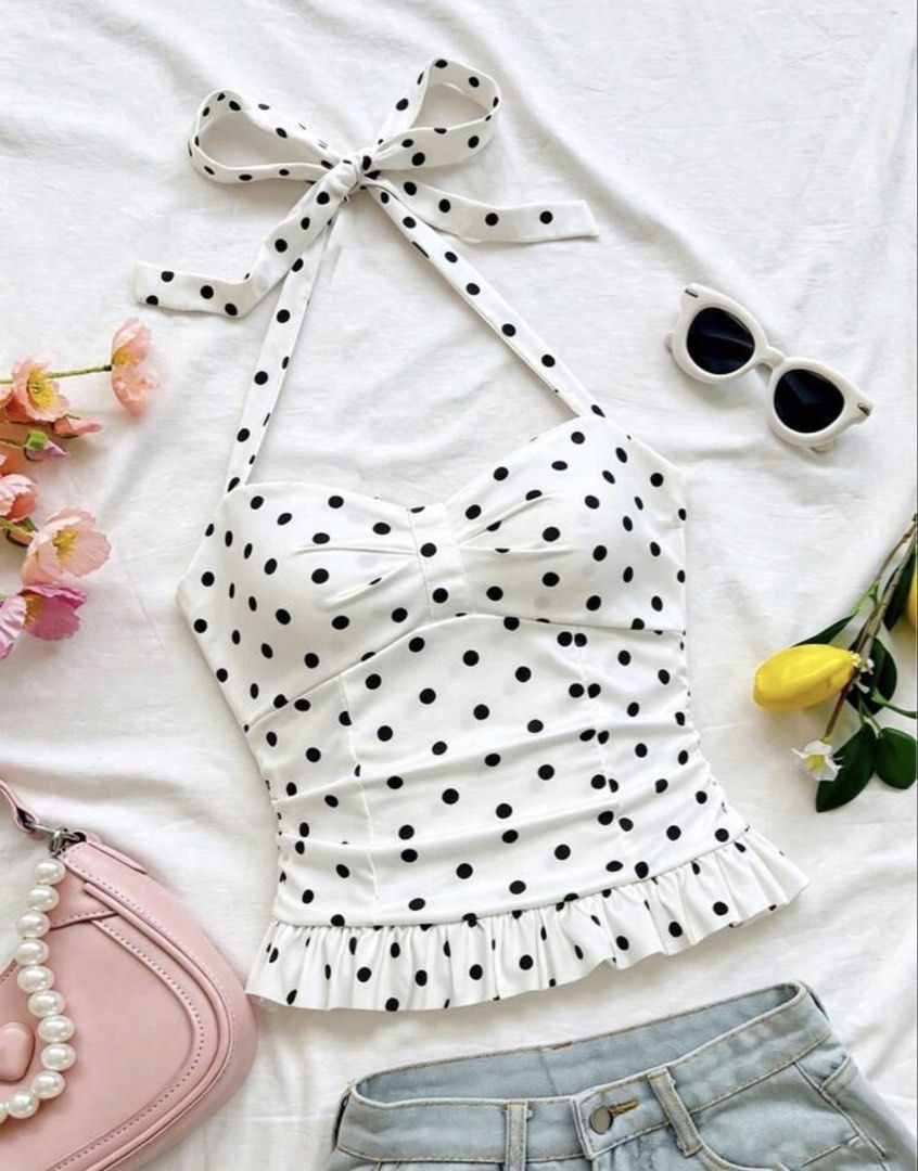 White Polka Dot Halter Neck Top with Ruffle Hem (Category: Sleeveless) located in Mandaluyong City. Submitted by prettyfindsbyb (Listing ID 1464496056, Image 2). Description: - DM for when worn! - Super cute white halter top - Black polka dot pattern - Sweetheart neckline - Ruffled hem detail - Ties at the neck with a bow - Flattering fit - Versatile: great with jeans or skirts - Ideal for summer days or a night out.