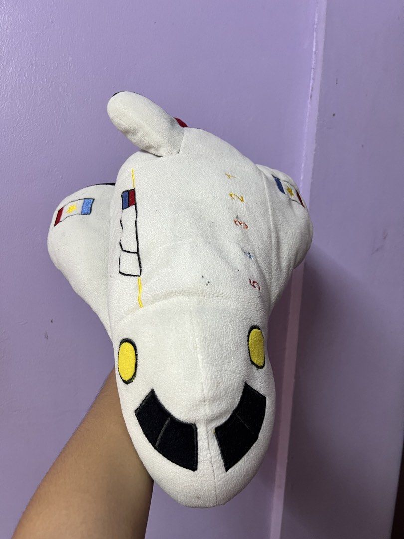 White Rocket Plush Toy (Category: Plushies & Soft Toys) located in Marikina City. Submitted by julmograsell (Listing ID 1464487893, Image 3). Description: - Adorable white rocket plush toy. - Features a Philippine flag patch on the side. - Embroidered numbers 1-5 along the top. - Cute red ball details on the back. - Made with soft, huggable material. - Ideal for space enthusiasts or as a unique decor item. - Washable .