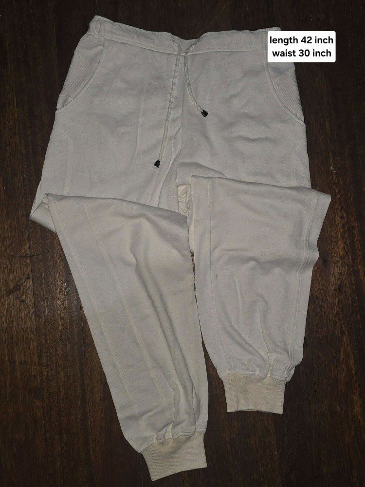 White to Cream Sweatpants with Drawstring Waist (Category: Joggers) located in Manila. Submitted by skmhm (Listing ID 1464393768, Image 1). Description: - Cream colored sweatpants - Elastic waistband with drawstring - Cuffed ankles - Side pockets - Waist: 30 inches - Length: 42 inches - Comfortable and casual.