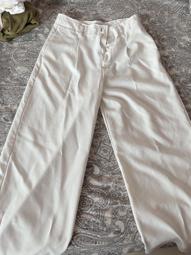 White Wide Leg Trousers (Category: Jeans) located in Cainta. Submitted by kitkatoli (Listing ID 1464364380, Image 1). Description: - High-waisted white trousers - Flattering wide-leg cut - Front zipper and button closure - Two functional side pockets - Comfortable linen-blend fabric - Effortlessly dress up or down - A versatile staple for any wardrobe.
