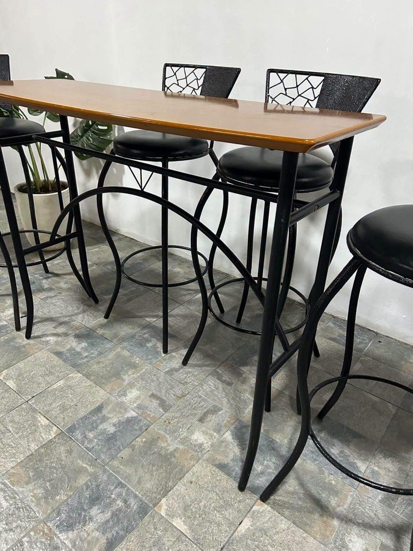 Wooden Bar Table with 4 Black Metal Stools (Category: Tables & Sets) located in Baguio. Submitted by nileh (Listing ID 1464377511, Image 2). Description: Imported Bar Table n Bar Chairs from Japan 47x18x38in/ Bar Table 40x30x14in/ Bar Chairs Complete Set Solid Wood Bar table 4pcs Bar Chairs Leather Padded Heavy duty No issue Good Condition Minor Scratch From Japan.