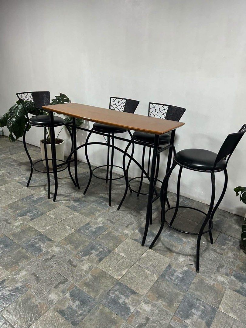 Wooden Bar Table with 4 Black Metal Stools (Category: Tables & Sets) located in Baguio. Submitted by nileh (Listing ID 1464377511, Image 3). Description: Imported Bar Table n Bar Chairs from Japan 47x18x38in/ Bar Table 40x30x14in/ Bar Chairs Complete Set Solid Wood Bar table 4pcs Bar Chairs Leather Padded Heavy duty No issue Good Condition Minor Scratch From Japan.
