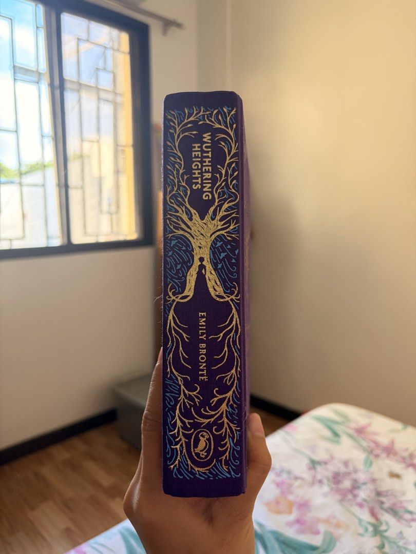 Wuthering Heights by Emily Bronte - Decorative Edition (Category: Storybooks) located in Marikina City. Submitted by _bananahanaa (Listing ID 1464504094, Image 3). Description: - Beautiful edition of Wuthering Heights by Emily Bronte. - Features a gorgeous tree design on the cover and spine. - Includes a convenient ribbon bookmark. - Pages are clean and crisp. - A lovely addition to any bookshelf..