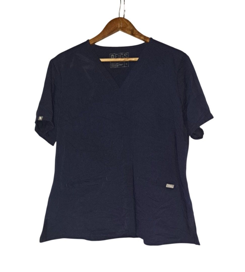 (XL) Figs Navy blue scrub top only (Category: Activewear) located in Tanauan. Submitted by scrubsuitshoppreloved (Listing ID 1464360986, Image 1). Description: .