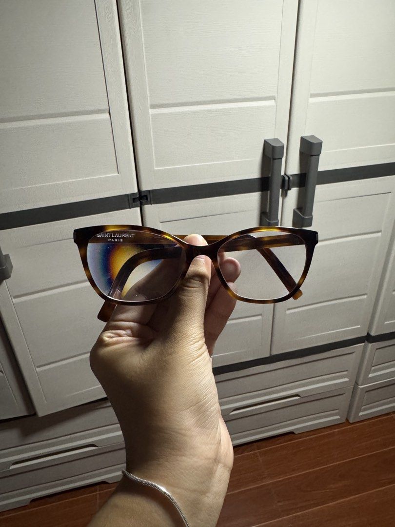 YSL Eyeglasses (Category: Sunglasses & Eyewear) located in Manila. Submitted by nicoleaure20 (Listing ID 1464510546, Image 1). Description: in good condition! it just has a loose screw on the left side that needs tightening :) - location: sampaloc, manila - mop: gcash/bpi - can be shipped thru lalamove/grab/ toktok/j&t but the buyer should shoulder the fee :) .
