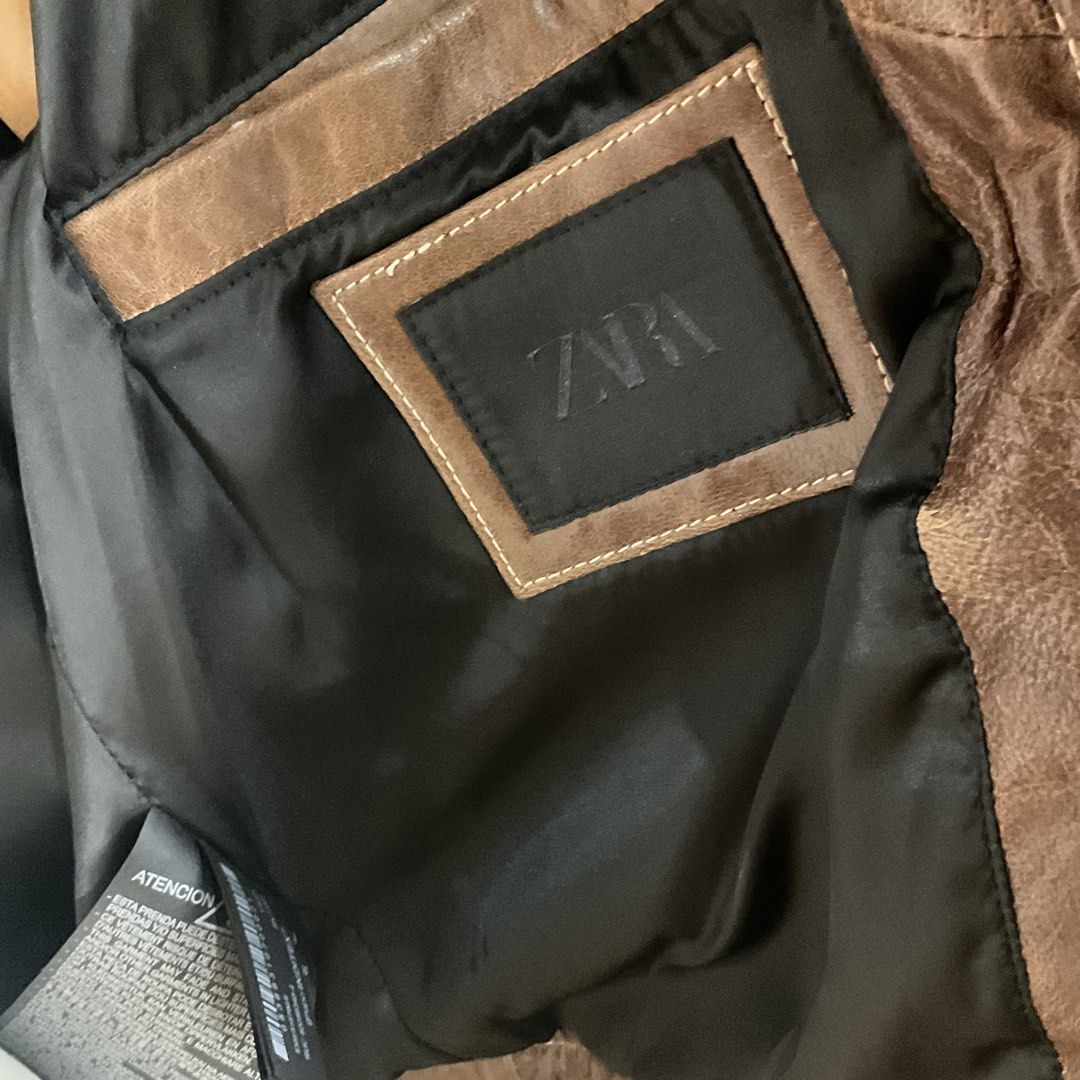 Zara Brown Washed Effect Leather Collection Jacket (Category: Coats, Jackets and Outerwear) located in La Trinidad. Submitted by di_tiyak (Listing ID 1464524681, Image 3). Description: L26 W24 - Zara Cool Brown Leather Jacket - From the Leather Collection with a washed effect - Two chest pockets - Button closure - Lined interior - Made in Pakistan - Size S.
