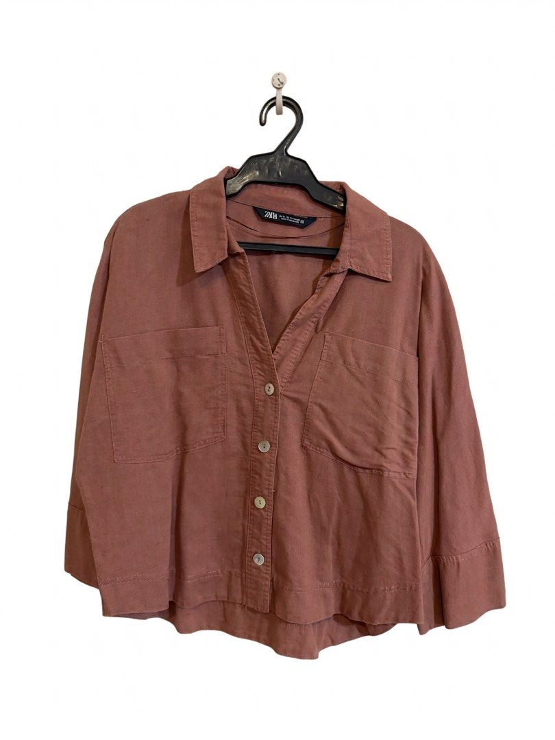 ZARA Linen Blend Cropped Shirt (Category: Shirts) located in Marikina City. Submitted by jamieas (Listing ID 1464476489, Image 3). Description: Rust-colored ZARA cropped shirt. Linen blend, collared, button-up with chest pockets. 3/4 cuffed sleeves. Perfect with jeans or skirts..