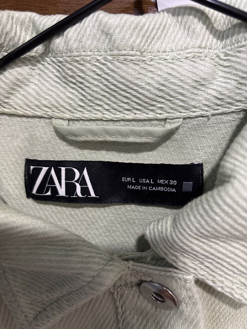 Zara Oversized Light Green Denim Shirt Jacket (Category: Coats, Jackets and Outerwear) located in Mandaluyong City. Submitted by clothescarousel (Listing ID 1464527579, Image 2). Description: - Zara Oversized Denim Shirt - Color: Light Green - Features: Raw hem detail, button-up front, chest pocket - Styling: Great worn open or closed, ideal for layering.