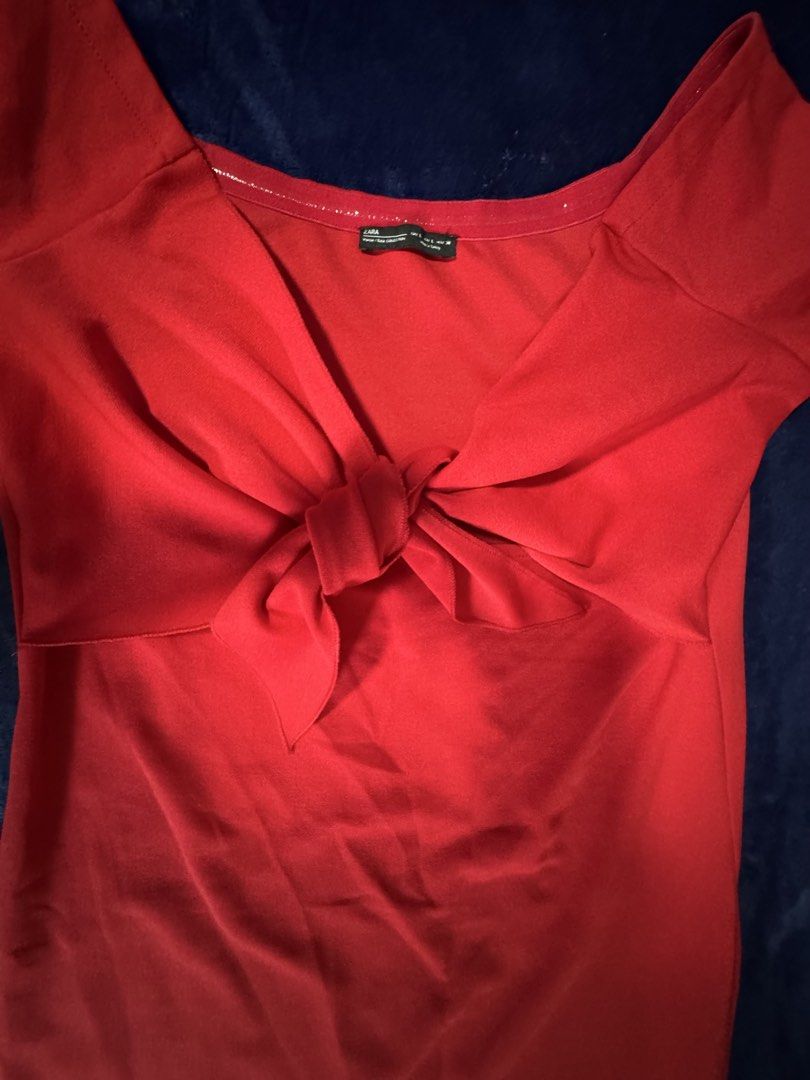 Zara Red Off-Shoulder Knot Front Dress (Category: Dresses) located in Quezon City. Submitted by candyclosetph (Listing ID 1464381913, Image 3). Description: - Zara Off-Shoulder Dress - Size: L - Features a cute knot detail at the front - Short sleeves - Made in Turkey - Ideal for night outs or parties.