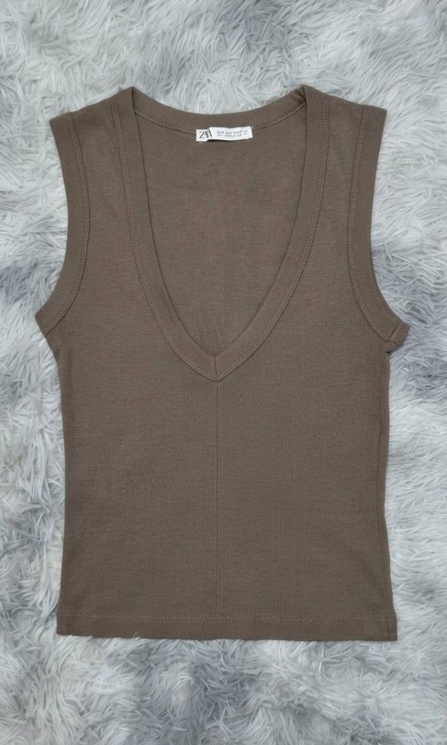 Zara V Neck Top (Category: Sleeveless) located in General Trias. Submitted by relove_closet8 (Listing ID 1464479550, Image 2). Description: • Washed and never used. • Cotton fabric. Stretchable. • Buyer handles shipping fee and book J&T or Lalamove only. • Payment first via bank transfer or e-wallet • No cancellation/return/refund of orders. 📍Lancaster, General Trias (Weekdays) 📍Las Piñas (Saturday & Sunday).