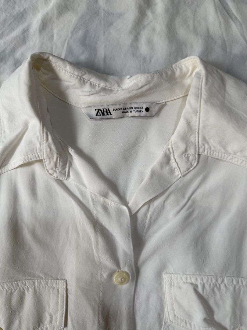 ZARA White Long Sleeve Button Up Shirt (Category: Longsleeves) located in Manila. Submitted by only_alyssacloset (Listing ID 1464398322, Image 2). Description: ZARA Cream White Long Sleeve Button Up Shirt Color: Cream White Size: Medium to Large.