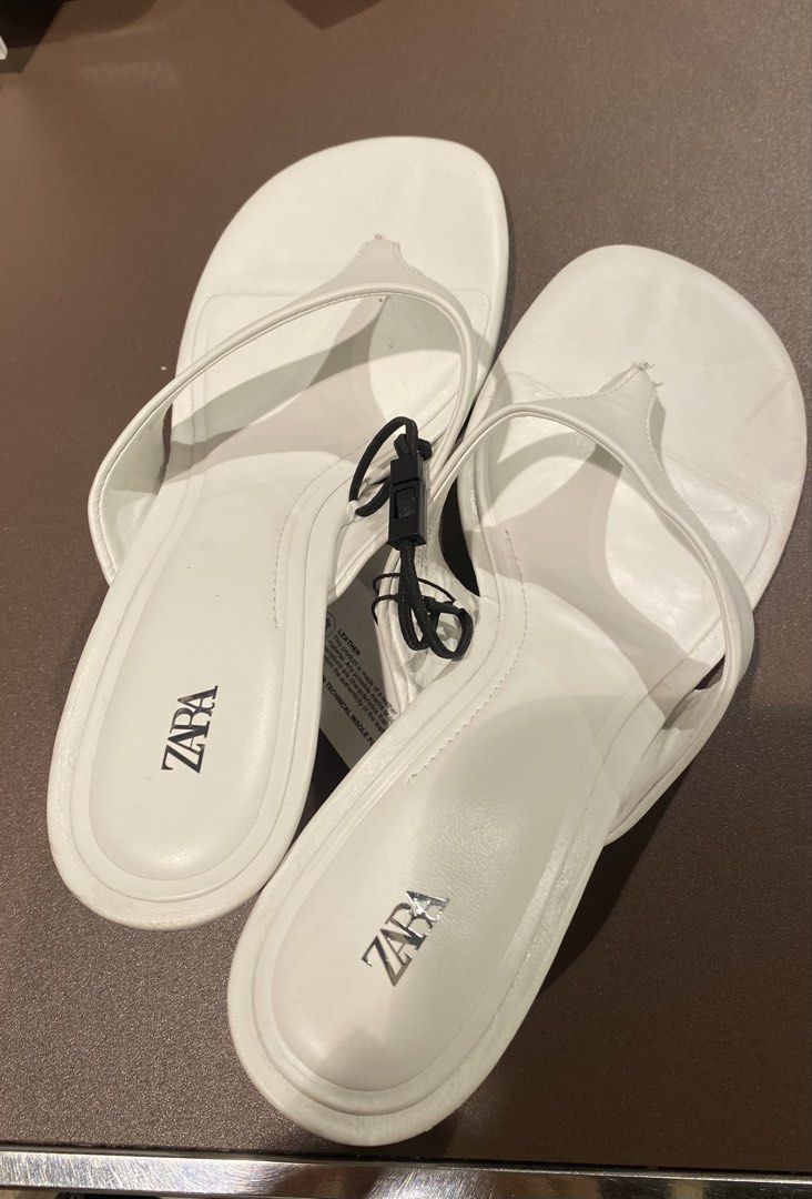 Zara White Thong Sandals EU39 (Category: Flats & Sandals) located in Manila. Submitted by cb_curations (Listing ID 1403592610, Image 3). Description: Zara white thong sandals Size: EU 39 / US 8 - Classic thong design - Small heel - Comfortable for daily wear.