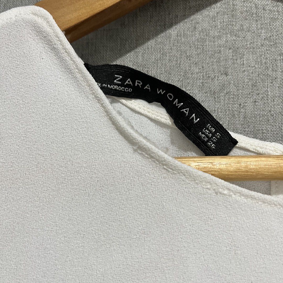 Zara Woman White Top (Category: Sleeveless) located in Manila. Submitted by samanthamaeb (Listing ID 1464494686, Image 3). Description: Used twice only Perfect for work With some stitching issues (see photo) but not obvious.