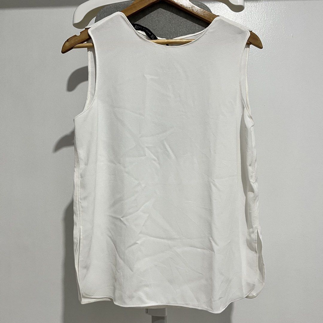 Zara Woman White Top (Category: Sleeveless) located in Manila. Submitted by samanthamaeb (Listing ID 1464494686, Image 2). Description: Used twice only Perfect for work With some stitching issues (see photo) but not obvious.