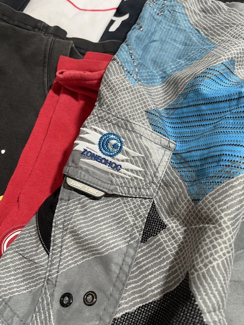 Zone Choc Board Shorts Grey Blue Plaid Surf Style (Category: Swim Trunks & Board Shorts) located in Baao. Submitted by plainclothesdept (Listing ID 1464530365, Image 3). Description: Zone Choc Surf Board Shorts waist - 32-36 in. length - 16 in. hem - 11 in. no flaws - Zone Choc board shorts - Grey with blue and black plaid pattern - Side cargo pocket - Drawstring waist - Ideal for beach or pool - Made from 100% polyester.
